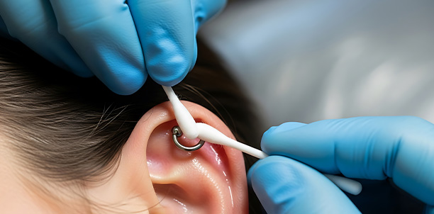 close-up of a person's nose with a silver nose piercing featuring a small gem stylish body jewelry 3 options