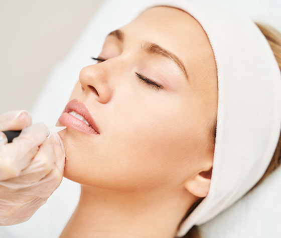 close-up of a woman's mouth featuring glossy red lipstick and smooth skin ideal for beauty makeup and cosmetics 1